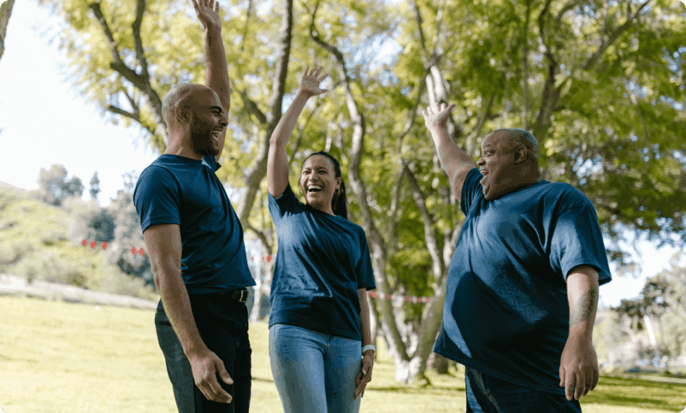 laughing people raising their hand